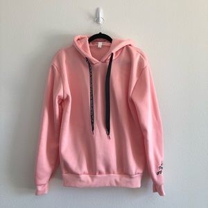 NWOT Bright Pink Hoodie with graphic strings